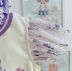 Conjunto Feminino Infantil Petit Cherie Blusa Off White com Mangas em Tule Floral e Shorts Lilás    
