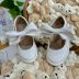 Tênis Infantil Feminino Maria Lua Slip On Verniz Off-White com Laço Boneca Removível e Velcro